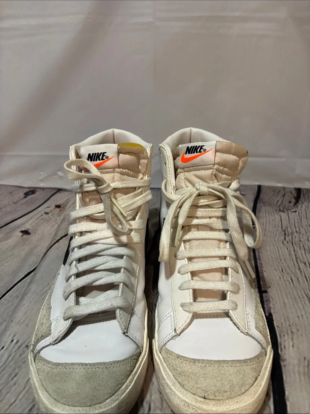 Nike White High-Top Sneakers with Black Stripe